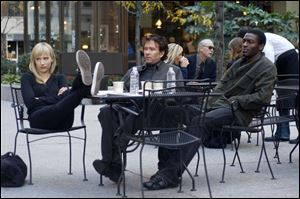 Nate Ford (Timothy Hutton), center, plays a disillusioned former insurance investigator who fi nds himself heading
a team of con men and thieves, including Parker (Beth Riesgraf) and Alec (Aldis Hodge), in  Leverage. 

