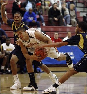 Southview's Jimmy Hall tries to split a pair of Columbus Brookhaven defenders last night at the Sullivan Center.