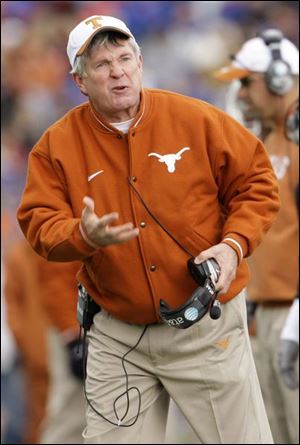 Texas coach Mack Brown, led his team to a neutral site victory over now No. 1 Oklahoma. 