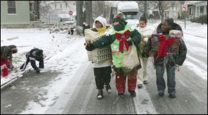 NBRE parade11p   12/06/2008     BLADE PHOTO/Lori King  Kids from East Toledo Family Center's Success After School program march during annual Christmas parade in East Toledo, OH.