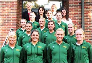Members of the Monroe St. Mary Catholic Central High School volleyball team are, from left, front row, Samantha Zdanowski, Carlie Giarmo, Kelsey Huntoon, Danielle Handler; second row, Megan Calender, Corinne Heller, Shelbi Lisecki; third row, Amber Cicero, Brittany Osburn, Sara Hudson; fourth row, Michelle DeMarco, Kristen Drabek, manager Arielle Vasquez, and fifth row, head coach Diane Tuller, manager Jenny Shaw, and assistant coach Kim Windham.
