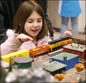nbrw swanton11p 12/06/2008  blade photo by herral long   Alexis Sarvo 6 of swanton  checks out model train display 0f  christmas events at swanton high