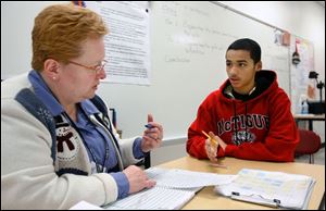 Millie Alvarez consults with Anthony Struffolino, 14, about state standards for a business letter to Santa. Macy s vows to donate $1 a letter up to $1 million to Make-A-Wish.