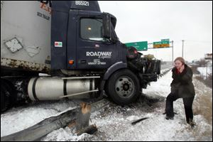 A tractor-trailer jackknifed near South Avenue when the driver tried to avoid crashing into a sedan that spun out of control on I-75.