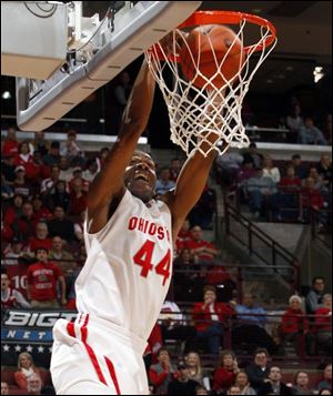 Ohio State's William Buford (44) throws down an alley-oop during the first half of their game against Iona at Value City Arena Saturday.