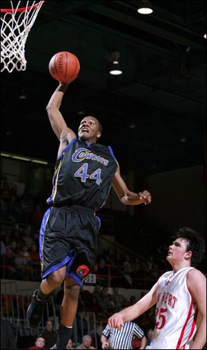 Mr. Basketball, Libbey s William Buford, dunks the basketball much to the chagrin of a St. Paris Graham player who is helpless to defend the play. The 6-5 Buford scored more than 2,000 points in his career and currently is getting a lot of playing time at Ohio State.
