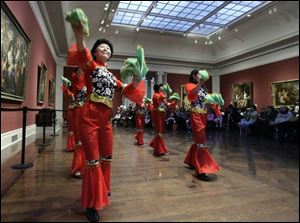 Slug:  CTY chinese05p Date:  01042009        The Blade/Andy Morrison       Location:  Toledo       Caption: Anna Che, left, and other dancers from the Chinese Association of Greater Toledo, perform a Chinese folk dance before nearly 150 people at the 2009 Winter Legacies Program at the Toledo Museum of Art, Sunday, 01042009.    Summary: