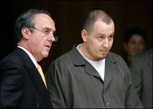 James Leroux, 23, right, with attorney Jerome Phillips, is accused of shooting an acquaintance in South Toledo.