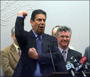 Jon  Bowzer  Bauman demonstrates his trademark move as Bowzer when he was in the band Sha Na Na at a 2006 news conference in Connecticut about his Truth in Music bill.