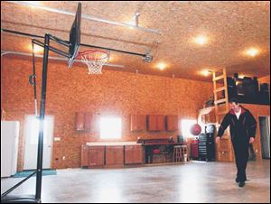 Mr. Allomong plays basketball in the new shop.