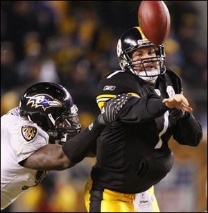 Ben Roethlisberger shovels a pass before the Ravens  Trevor Pryce can bring him down. Roethlisberger threw for 255 yards.
