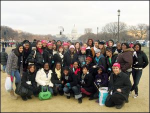 A group of UT students are shown at the Inauguration of Barack Obama.
