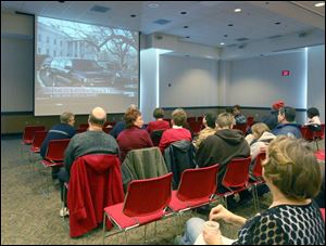 Scott and Sarah Coulter went to the main library downtown to watch the inauguration. 'It's something we should be celebrating together as a country,' Mrs. Coulter said. the blade/lisa dutton Main library visitors, above, were among about 200 who took part in viewing parties.