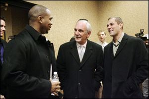 Manager Jim Leyland is flanked by Tigers Marcus Thames, left, and Michael Hollimon at the Mud Hens Fandemonium.