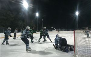 SPT icehockey10p   02/09/2009     The Blade/Lori King  Lake goalie Tony Horvath comes up with a save late in the 3rd period against Ottawa Hills, during game at Ottawa Park Ice Rink in Toledo, OH. Lake's record is 7-3-1. Lake won the inaugural Winter Classic Cup tonight. 
S3 s3icehockey 9.3