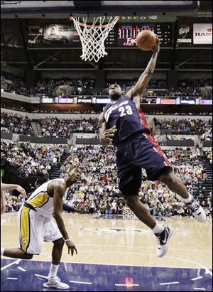 Cleveland's LeBron James goes up for a dunk. James had 47 points in the game.