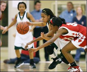Start s Maleeka Kynard (back) steals the ball from Central sSierra Calhoun. Kynard hit four 3-pointers and had 20 points.