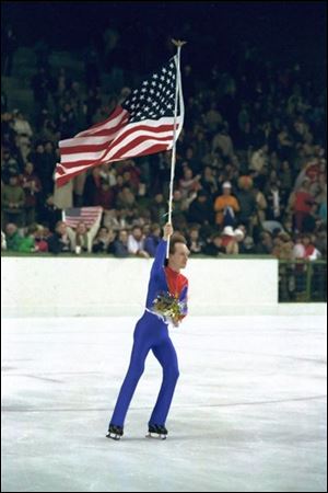 A philanthropist, writer, and cancer survivor today, Scott Hamilton takes his victory lap upon winning Olympic gold in 1984.