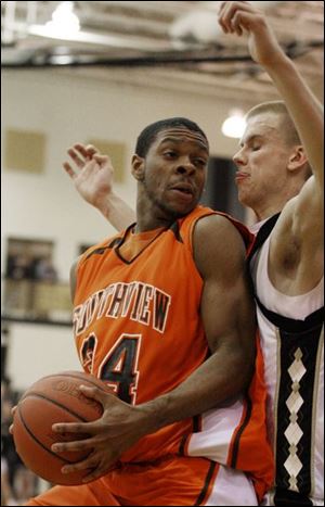 Perrysburg s Charlie Hughes, who scored 23 points, defends Southview s Allen Gant.
<br>
<img src=http://www.toledoblade.com/graphics/icons/video.gif><b><font color=red> VIDEO</b></font color=red>: <a href=