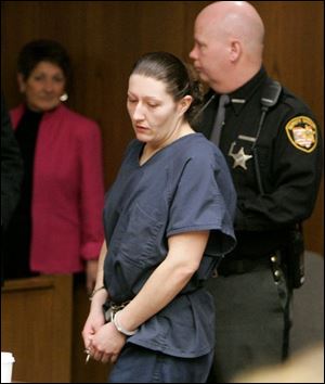 Mandi Abdo arrives in Toledo Municipal Court for arraignment. She is accused of murder, aggravated burglary, and aggravated robbery in a Feb. 6 break-in at the home of 83-year-old Cecelia Sobecki. Police say Ms. Sobecki was pushed to the floor twice during a robbery and died two days afterward. The Lucas County coroner ruled her death a homicide.