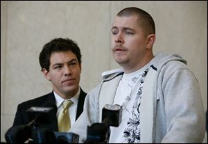 Chad Snyder, right, alongside Ben Konop, said his dog was killed.