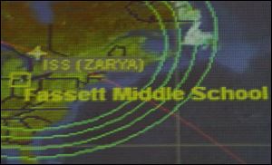 A map indicates the relative positions of the International Space Station and Fassett Middle School during the linkup. 