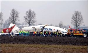 A Turkish Airlines plane with 134 aboard slammed into a field while attempting to land at Amsterdam's Schiphol Airport on Wednesday and broke into three pieces.
<br>
<img src=http://www.toledoblade.com/graphics/icons/video.gif><b><font color=red> VIDEO</b></font color=red>: <a href=