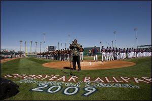 Jessie McGuire opens Goodyear Park with the national anthem before the Indians played the Giants yesterday. The state-of-the-art park seats 8,000 and is near the team's training facility.