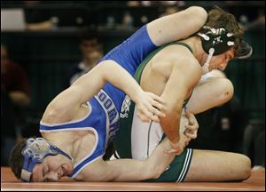 Troy Christian's Chris Burns, right, gets a reversal against Elmwood's Alex Betts in their 145-pound championship match. The two points for the reversal were the only points scored. 
