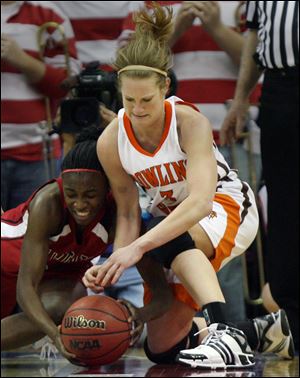 Bowling Green s Lindsey Goldsberry battles Ball State s Porchia Green for a loose ball. The Falcons most likely lost their shot at an NCAA bid, but they are guaranteed a spot in the NIT.