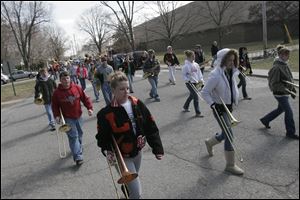 The young musicians step out for a practice before they join nearly 200 other bands that will march up Manhattan's Fifth Avenue past the Metropolitan Museum of Art. 