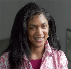Carolyn Lucas was rescued by Toledo Mayoral candidate Mike Bell on Monday after a car accident left her car upended and her hanging by the seatbelt.