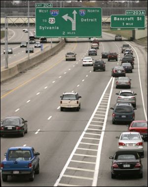 Rush-hour traffic heads north from downtown Toledo. Twenty-six percent of the metro area s jobs are within three miles of downtown, a study shows.