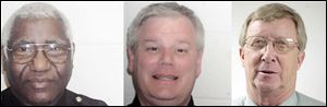 Former Sheriff s Sgt. John Gray, left, and Deputy Jay Schmeltz, center, are charged with deprivation of rights and falsification of documents. Capt. Robert McBroom also is charged in the jail death. 