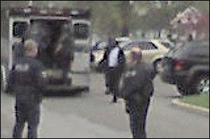 Police are shown at the Sunset House at 4040 Indian Road.