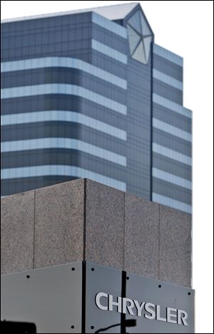Signage is displayed outside the headquarters of Chrysler LLC in Auburn Hills, Michigan, U.S., on Saturday, April 25, 2009. Chrysler LLC's banks reached a tentative agreement with the U.S. government to exchange $6.9 billion in secured debt for $2 billion in cash, according to a person with knowledge of the negotiations. Photographer: Jeff Kowalsky/Bloomberg News