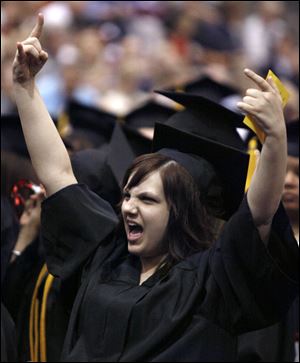 Slug: CTY OWENSGRAD08P A         The Blade/Jeremy Wadsworth  Date: 05/08/09  Caption: Jessica Utell celebrates graduating with an Associate degree of Applied Science (massage therapy) Friday, 05/08/09, at Owens Community College.