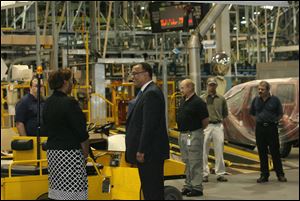 Ed Montgomery tours the Toledo Jeep Assembly plant as part of his visit to Toledo. He said he s aware of how the auto industry s collapse affects more than just assembly plant workers.
