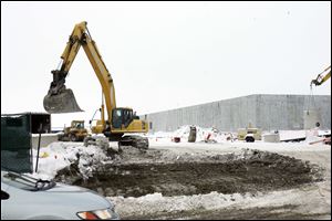First Solar's plant in Perryburg Township takes shape under the eye of Program Solutions Group. The construction management firm has two other building projects going in the Toledo area.