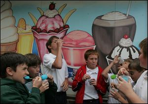 ROV reward  05/26/2009     The Blade/Lori King  OLPH 6th graders from left: Zach Stearns, Zachary Roller, Matt Cark, Chase Petrie, Jordan Rodriguez, Isaac Kookoothe and Ben Dubielak (all names cq'd) enjoy cold treats at Lickity Split in Toledo, OH. The boys were rewarded ice cream treats from their gym teacher, Amy Ashner, for earning a perfect score of 10 points throughout the year for 