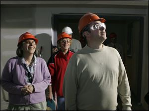 School board member Ellen Scholl, left, assistant superintendent of schools Diane Tache, and Bruce Corrigan, band director, take a look at what will be the band room in the new junior high school.