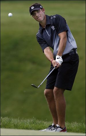 Texas A&M's Andrea Pavan chips onto the 2nd hole. The Aggies play Arkansas Saturday.