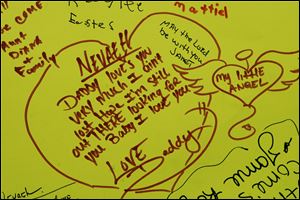 Nevaeh Buchanan s father, Shane Hinojosa, is among the many who have written notes on a sign board posted outside the Monroe apartment complex where she disappeared almost a week ago.