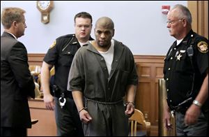 Robert Wielinski is escorted from the courtroom after being sentenced to life in prison in the death of his infant son.