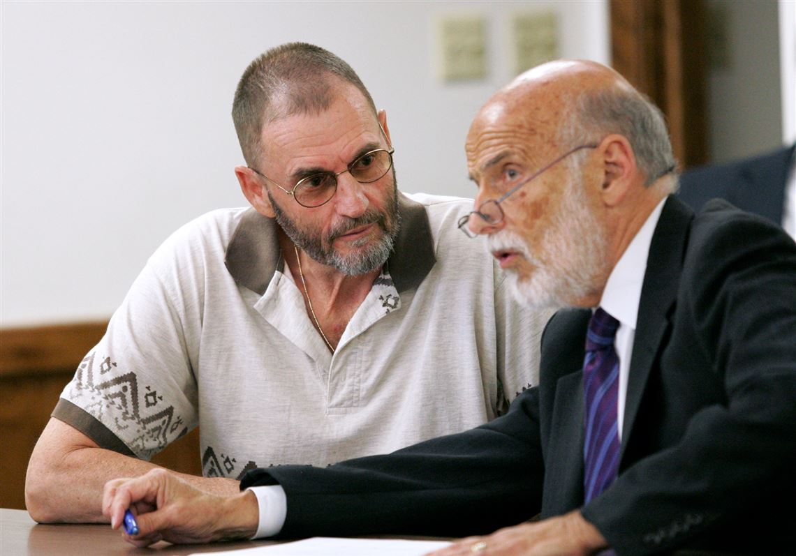 Thomas Zich talks with his attorney, Alan Konop, before jury selection for his trial in Lucas County Common Pleas Court.