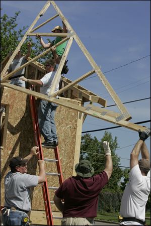 Mr. and Mrs. Norris  new home in Monroe and another being built next door are among 312 Habitat for Humanity homes nationwide sponsored by Thrivent Financial for Lutherans.