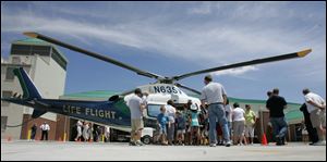 NBRS fire01p  06/27/2009     The Blade/Lori King  Life Flight is surrounded by on-lookers during open house of the new Perrysburg Township Fire Dept. station in Perrysburg Township, OH.