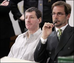 Dana Todd Rister, left, with his attorney, David Klucas, at the April trial that ended in a mistrial, is accused
of murdering Debra Pioterek in a shed. Ms. Pioterek's body was found near the former Southwyck Shopping Center. Rister,
42, is claiming self-defense in
the case.