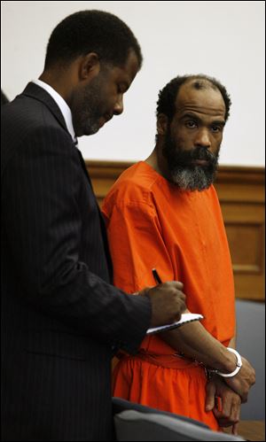 Gerald Catchings, in court with his lawyer, Myron Duhart, is accused of using a handmade weapon to assault guards while being transferred to a solitary confinement unit at the Toledo Correctional Institution. He already was serving a life sentence for murdering a fellow inmate in 2006 at the Southern Ohio Correctional Facility. Mr. Duhart has requested evaluation of his competency to stand trial.