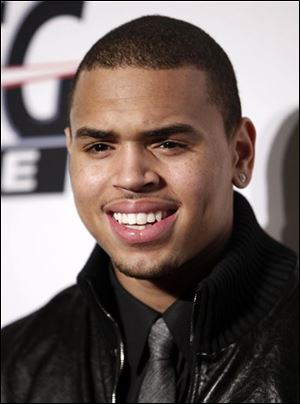 In this Feb. 7, 2009 file photo, Chris Brown arrives at the Clive Davis pre-Grammy party in Beverly Hills, Calif. 